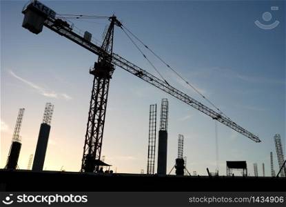 The construction crane on sunset