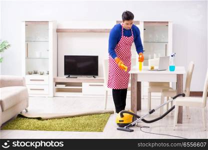 The contractor man cleaning house doing chores. Contractor man cleaning house doing chores