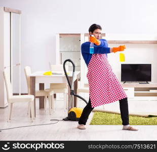 The contractor man cleaning house doing chores. Contractor man cleaning house doing chores