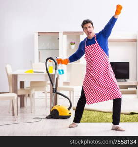 The contractor man cleaning house doing chores. Contractor man cleaning house doing chores