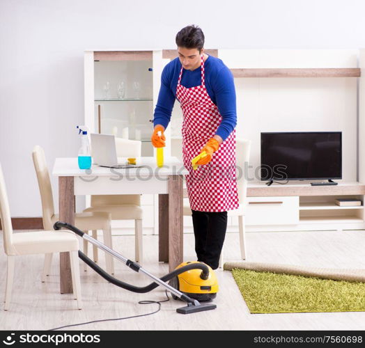 The contractor man cleaning house doing chores. Contractor man cleaning house doing chores