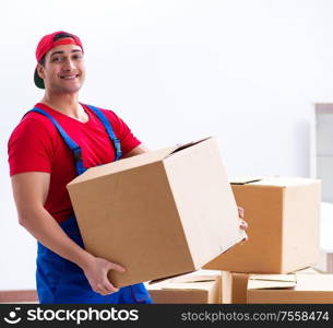 The contractor worker moving boxes during office move. Contractor worker moving boxes during office move