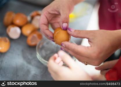 the cook breaks the chicken egg while preparing a delicious dish