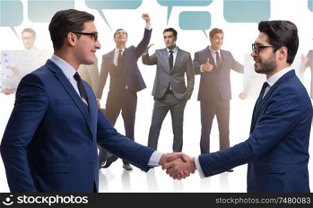 The cooperationa and teamwork concept with handshake. Cooperationa and teamwork concept with handshake