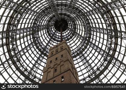 The Coops Shot Tower was completed in 1888 and is 50 metres high. The historic building was encased by a 84 metres high conical glass roof, in the heart of the city of Melbourne, Victoria, Australia. Melbourne a?? Coops Shot Tower