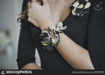 The corsage on the girls hand.. The girl with the buttonhole on his arm 4467.
