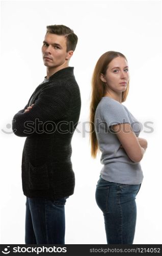 The couple got into a fight and standing with their backs to each other in the frame