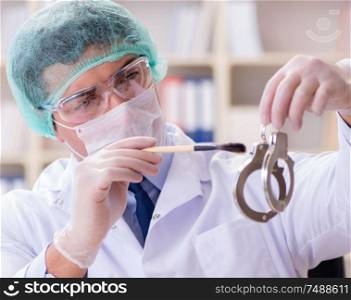 The criminologist police chemist looking at crime evidence. Criminologist police chemist looking at crime evidence