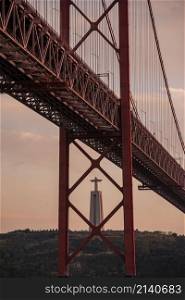 the Cristo Rei Statue and the Ponte 25 de Abril or 25the April Bridge at the Rio Tejo near the City of Lisbon in Portugal. Portugal, Lisbon, October, 2021