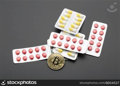 The cryptocurrency bitcoin as a payment option for medicines.Business concept. The cryptocurrency bitcoin as a payment option for medicines.Over black