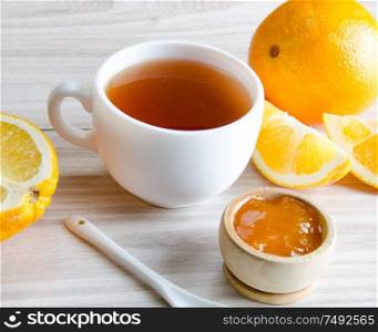 The cup of tea served with orange jam. Cup of tea served with orange jam