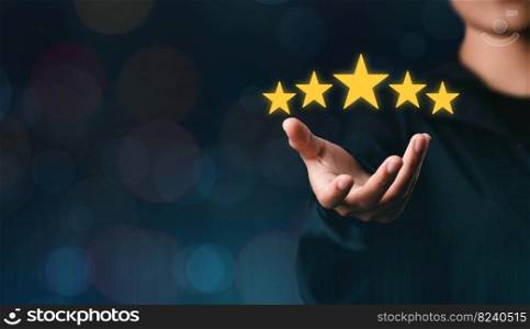 The customer&rsquo;s hand or the customer holds a star to complete five stars. with copy space five star rating excellent award service rating Satisfaction Concept comment