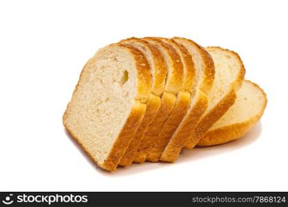 The cut loaf of bread isolated on white
