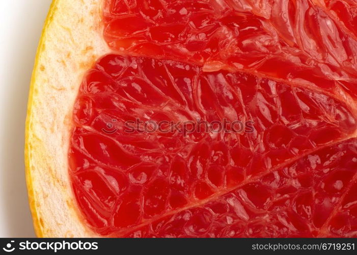 The cut of red grapefruit. Macro