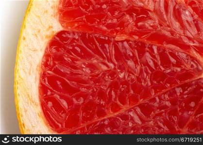 The cut of red grapefruit. Macro