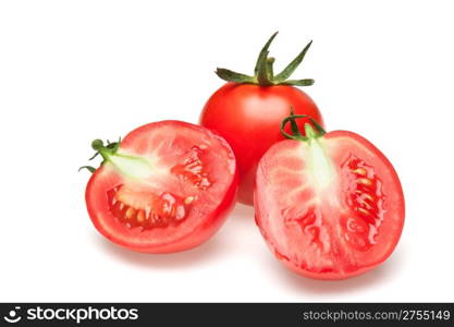 The cut tomatoes. It is isolated on a white background