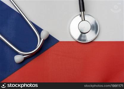 The Czech Republic flag and stethoscope. The concept of medicine. Stethoscope on the flag in the background.. The Czech Republic flag and stethoscope. The concept of medicine.