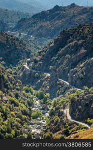 The D84 road and Golo river winding their way through the hills of central Corsica
