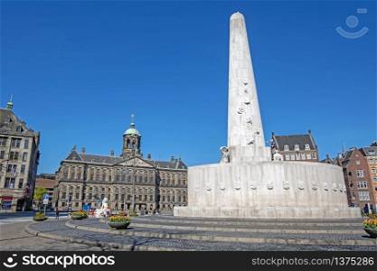 The Dam Square in Amsterdam Netherlands with the National Monument and the Royal Palace