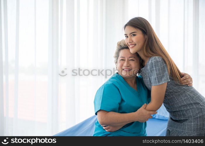 The daughter visits the grandmother who is sick in the hospital.