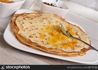 the delicious pancakes with orange jam