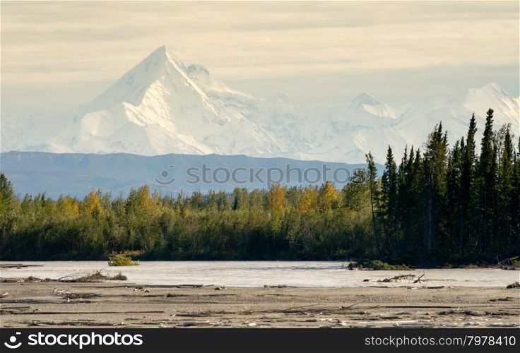 The Delta River curves around beneath the peaks of the Alaska Mountain Range