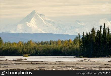 The Delta River curves around beneath the peaks of the Alaska Mountain Range
