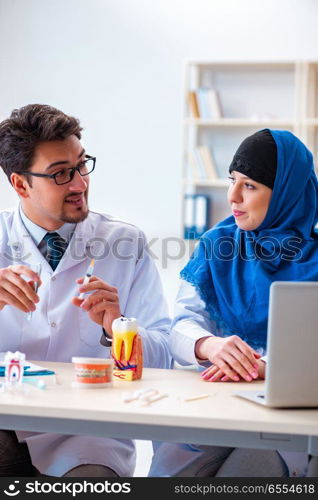 The dentist doctor and assistant working on new tooth implant. Dentist doctor and assistant working on new tooth implant