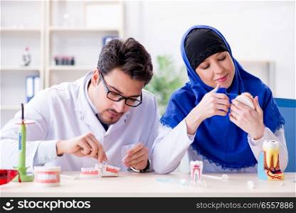 The dentist doctor and assistant working on new tooth implant. Dentist doctor and assistant working on new tooth implant