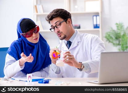 The dentist doctor and assistant working on new tooth implant. Dentist doctor and assistant working on new tooth implant