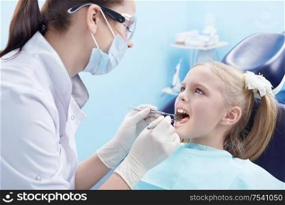 The dentist treats teeth patient