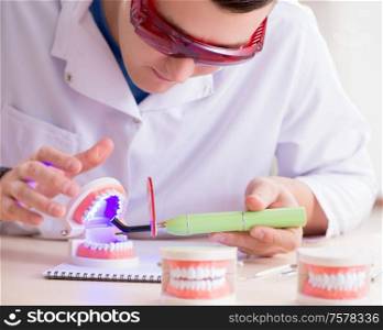 The dentist working teeth implant in medical lab. Dentist working teeth implant in medical lab