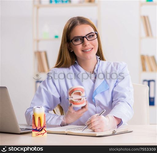 The dentistry student practicing skills in classroom. Dentistry student practicing skills in classroom