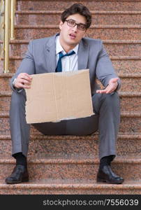 The desperate businessman begging on the street. Desperate businessman begging on the street