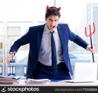 The devil angry businessman in the office. Devil angry businessman in the office