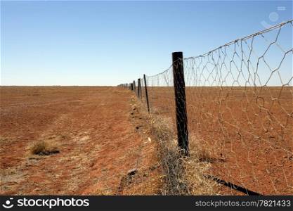 The Dingo fence in the Australian Outback. Fence is 9600 km long and spans the entire country, keeping the dingoes out of the south where sheep graze.