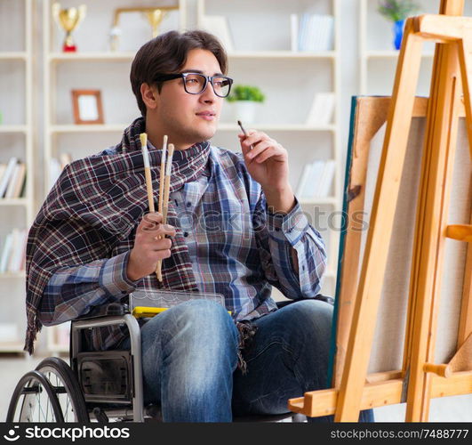 The disabled artist painting picture in studio. Disabled artist painting picture in studio