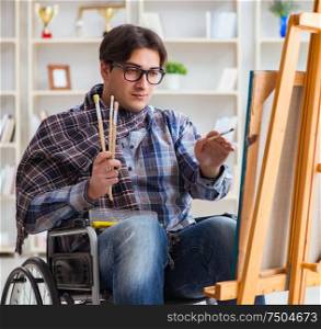 The disabled artist painting picture in studio. Disabled artist painting picture in studio