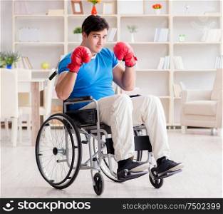 The disabled boxer at wheelchair recovering from injury. Disabled boxer at wheelchair recovering from injury