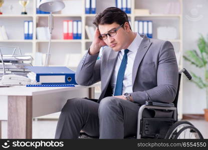 The disabled businessman working in the office. Disabled businessman working in the office