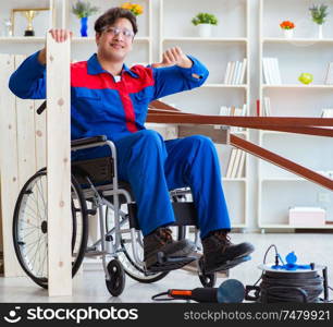 The disabled carpenter working in workshop. Disabled carpenter working in workshop