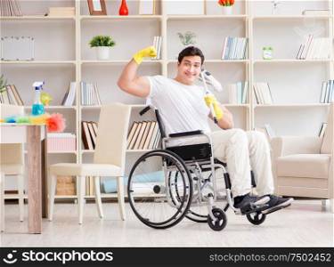 The disabled man cleaning floor at home. Disabled man cleaning floor at home