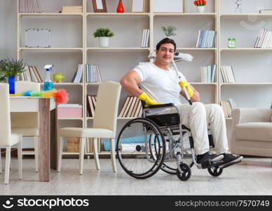 The disabled man cleaning floor at home. Disabled man cleaning floor at home