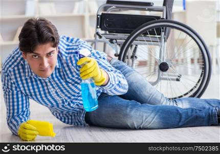 The disabled man on wheelchair cleaning home. Disabled man on wheelchair cleaning home