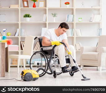 The disabled man with vacuum cleaner at home. Disabled man with vacuum cleaner at home