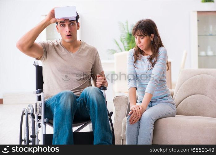 The disabled man with virtual glasses . Disabled man with virtual glasses