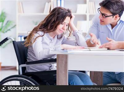 The disabled student studying and preparing for college exams. Disabled student studying and preparing for college exams