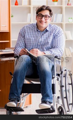 The disabled student studying at home on wheelchair. Disabled student studying at home on wheelchair