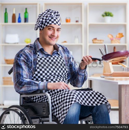The disabled young husband frying at kitchen. Disabled young husband frying at kitchen