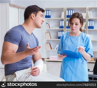The doctor and patient during check-up for injury in hospital. Doctor and patient during check-up for injury in hospital